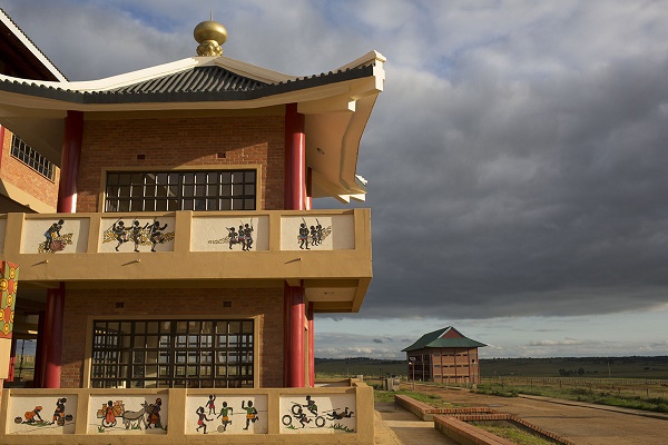 The facade of the Buddhist temple is adorned with paintings in the local Swazi style. The clash of Chinese palatial architecture and local art comes together at the Amitofo Care Centre near Nhlangano, Swaziland. In the distance is the primary school, which was opened by King Mswati III, who gifted the land to the centre. Amitofo houses some 180 orphans and vulnerable children here, where they learn the local school curriculum as well as Buddhism, Mandarin Chinese and Kung Fu. CORNELL TUKIRI © 27 February 2017