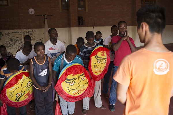 Kung Fu lesson is over and student bow to 'coach' Wang Yinggang (20), which is the traditonal way of greeting and departing from their coach. Yinggang is from Hunan in China and is one of a few from China who have volunteered to come to Swaziland to lend his experience to the  students in Swaziland. He runs drills and demands respect and precision when he takes the students through their routines. He also believe that currenly Jet Li is his favourite practitioner being uccessful and a true martial artist. CORNELL TUKIRI 02 March 2017